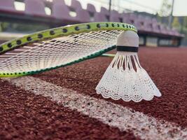 Badminton racket and shuttlecock on background photo
