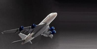 Airplane isolated on dark background photo