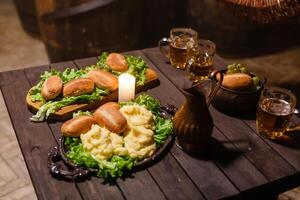 Lanterns on table with beer. candlesticks and beer on a wooden old table. photo