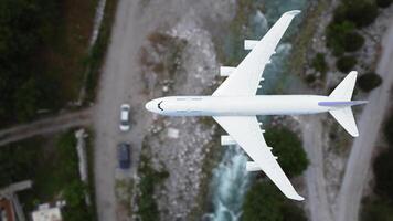 plane flies above the landscape. Side view of aircraft. Travel and transportation concept. photo