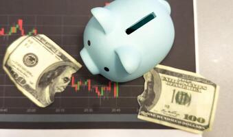 Piggy bank investment with a graph of investment returns in the background. Concept for financial security and savings. photo