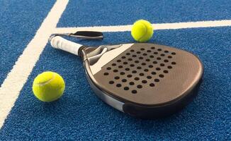 Paddle objects on blue turf photo