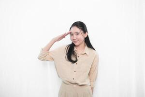 Expression of Indonesian Asian model woman in white dress smiling and respectful attitude photo