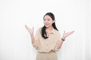 The expression of the Indonesian Asian model woman in white is smiling and the code is not knowing photo
