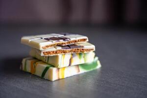 Piece of trend Dubai white chocolate with halva paste. Confectionery handmade sweets at home in the kitchen. High quality photo