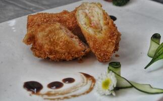 Delicious Apple Spring Roll Snack with Fresh Sauce photo