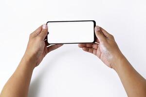 Male hand shows the screen of a mobile smartphone which has a white screen photo