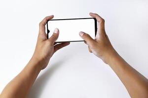 Someones hand is pressing and pointing at the screen of a smartphone photo