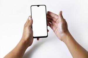 Male hand shows the screen of a mobile smartphone which has a white screen photo
