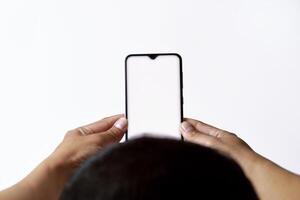 A mans and his hands are using and looking at a mobile smartphone photo