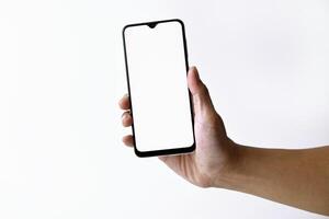 Male hand shows the screen of a mobile smartphone which has a white screen photo