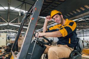 Caucasian engineer using a laptop in a factory. man working in plastics factory. photo