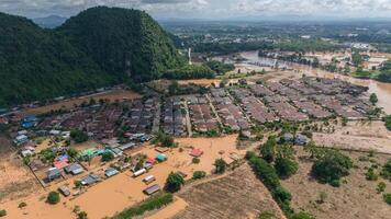 Aerial view of housing estate in suburb of Chiang Rai flooded by Kok river after typhoon Yagi has swept Southeast Asia. photo