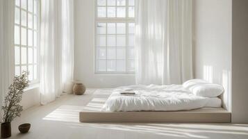 A white bedroom with a bed and a window photo
