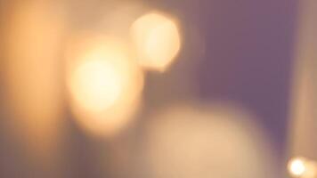Golden bokeh festive background with soft, twinkling lights and a glowing effect photo