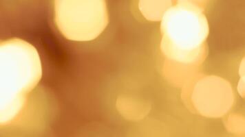 Golden bokeh lights with a soft and elegant glow, perfect for holiday celebrations photo