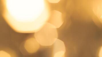 Golden bokeh festive lights with a soft, warm glow creating a cheerful atmosphere photo