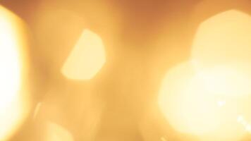 Golden bokeh festive lights with a soft, warm glow creating a cheerful atmosphere photo
