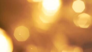 Shimmering golden bokeh lights in a vibrant holiday background with a radiant glow photo