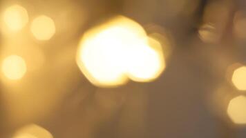 Golden bokeh festive background with soft, twinkling lights and a glowing effect photo