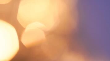 Golden bokeh festive background with soft, twinkling lights and a glowing effect photo
