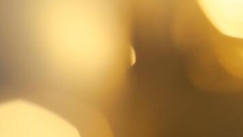Golden bokeh festive background with soft, twinkling lights and a glowing effect photo