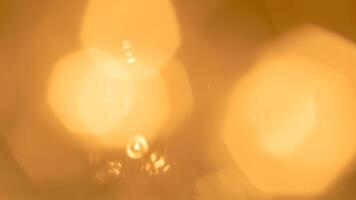 Golden bokeh festive lights with a soft, warm glow creating a cheerful atmosphere photo