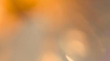 Golden bokeh festive background with soft, twinkling lights and a glowing effect photo