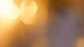 Golden bokeh festive background with soft, twinkling lights and a glowing effect photo