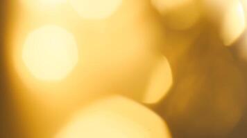 Golden bokeh festive background with soft, twinkling lights and a glowing effect photo