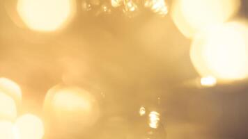 Vibrant festive golden bokeh with sparkling lights and a warm holiday glow photo
