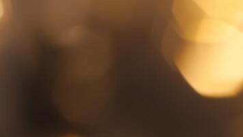 Golden bokeh festive background with soft, twinkling lights and a glowing effect photo