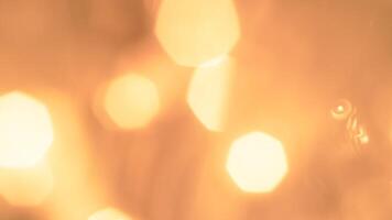 Golden bokeh festive lights with a soft, warm glow creating a cheerful atmosphere photo