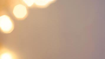 Golden bokeh festive lights with a soft, warm glow creating a cheerful atmosphere photo