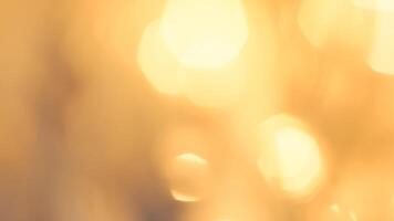 Golden bokeh festive lights with a soft, warm glow creating a cheerful atmosphere photo