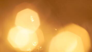 Golden bokeh festive lights with a soft, warm glow creating a cheerful atmosphere photo