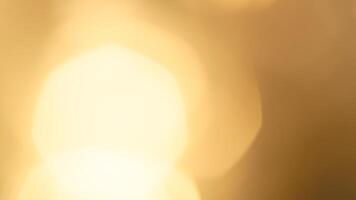 Golden bokeh festive lights with a soft, warm glow creating a cheerful atmosphere photo
