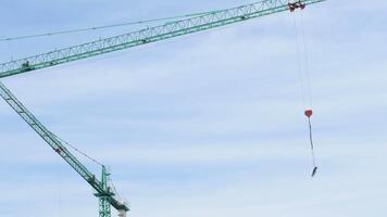 Crane transporting a module of a building under construction video