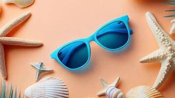 Blue sunglasses with seashells and starfish on a peach background video