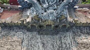 An aerial view of a large statue in a temple video
