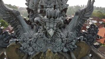 A statue of an eagle on top of a building video