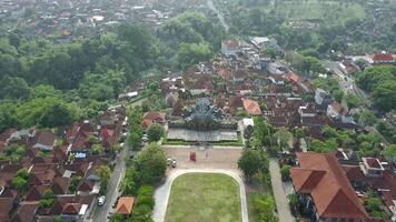 An aerial view of a town with a statue in the middle video