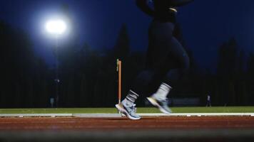 Female Athlete is Running Towards an Obstacle, Hurdling, Jumping Over the Barrier at High Speed while Sprinting in a Race. Cinematic Super Slow Motion video