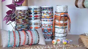 A Vibrant and Colorful Display of Unique Handmade Bracelets and Various Accessories video
