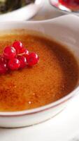 Caramel custard pudding on a plate on table video