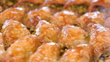 Enjoy the mouthwatering and delicious Baklava Slices that come with a delightful Pistachio Topping video