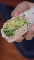 Enjoy a delicious Fresh Lettuce Wrap filled with flavorful Ham conveniently held in your Hand video