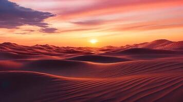 A vast desert landscape during sunset, showcasing the peaceful solitude of a barren terrain under a clear sky with soft clouds. The golden orange light from the setting sun creates a serene video