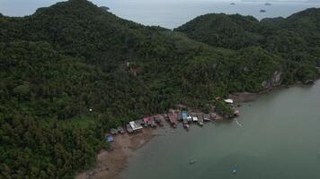 Koh chang Ranong Thailand.A view of a beach with a small village on the shore video