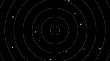 A black background with white circles on it video